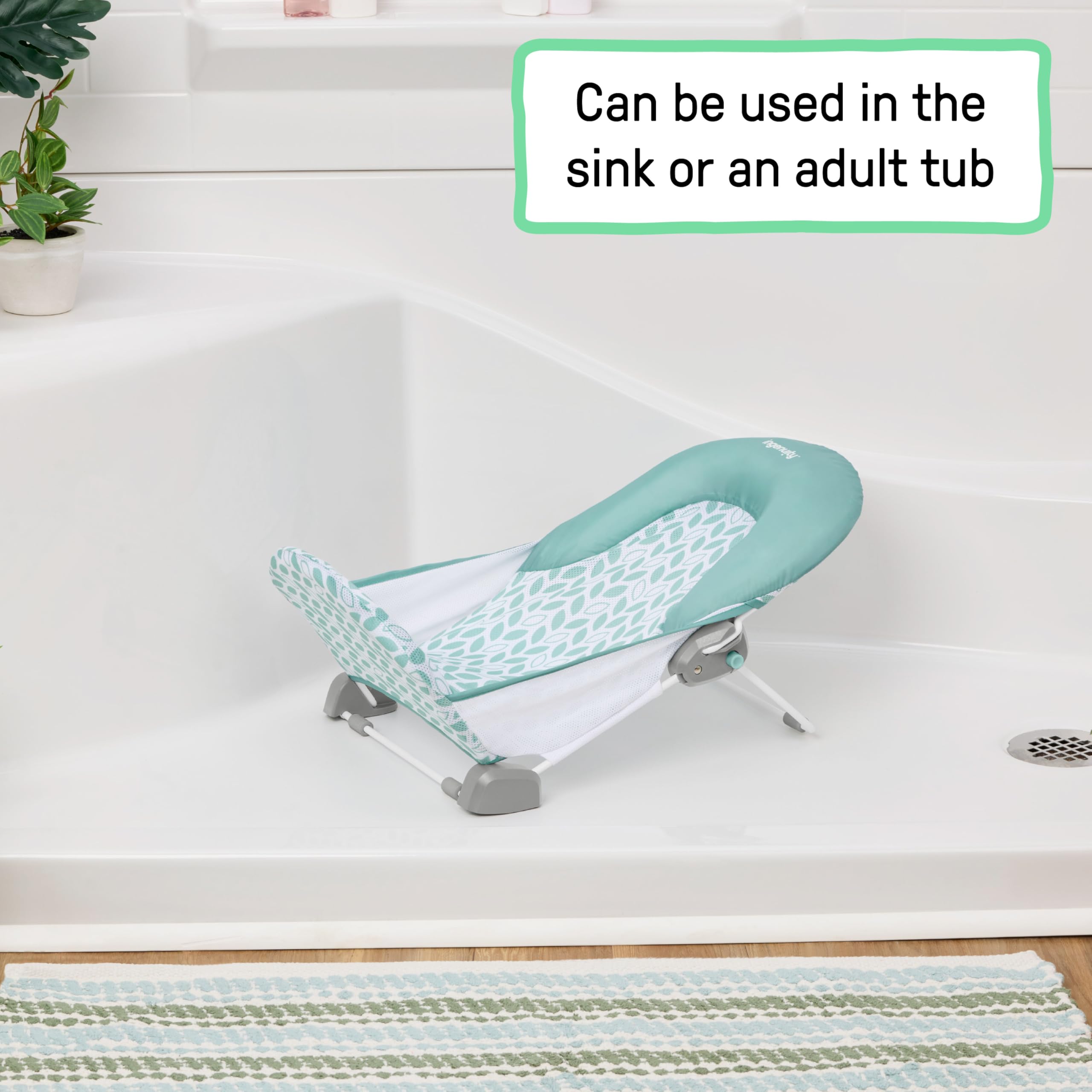 Ingenuity bather placed in adult bathtub illustrating secure use