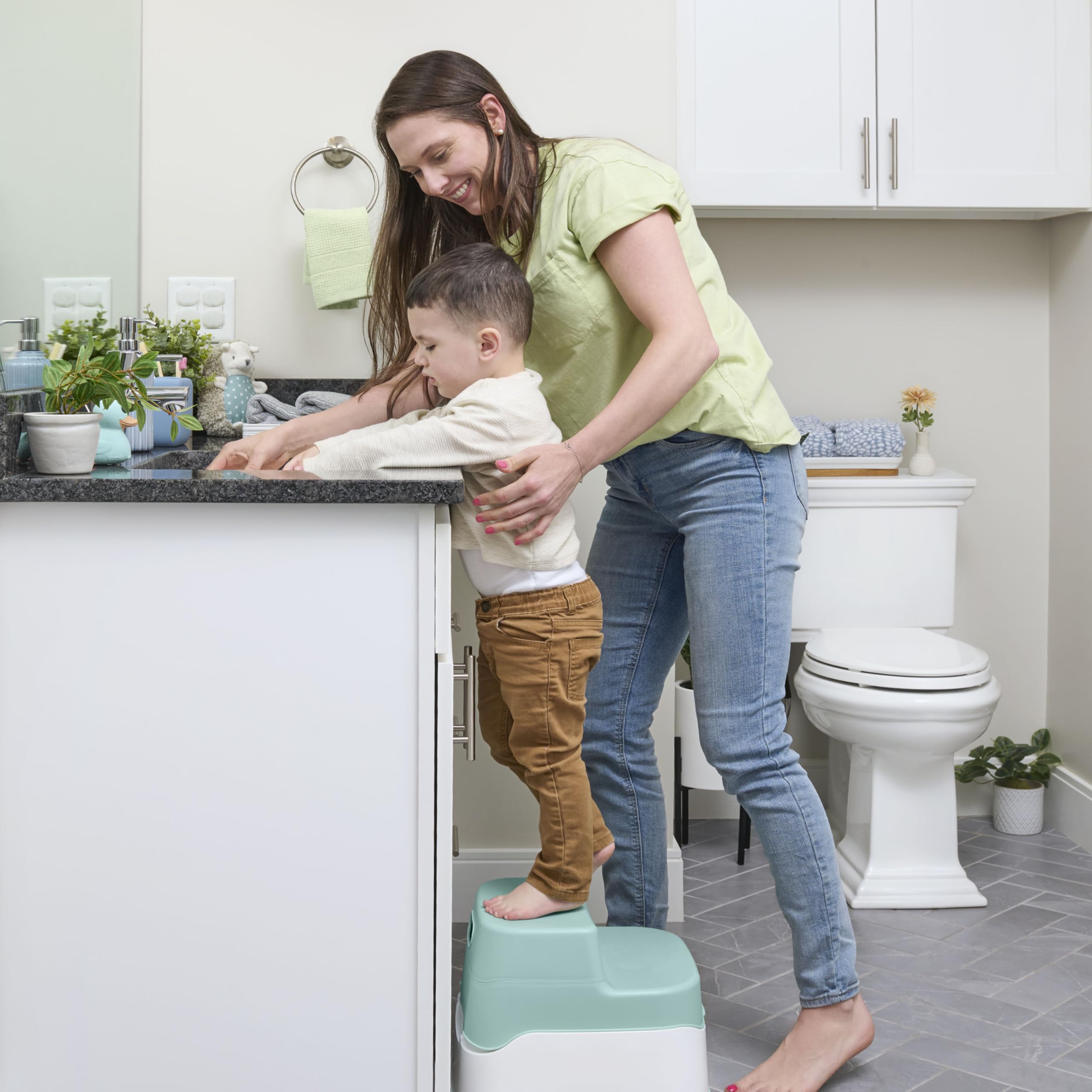 Ingenuity side-by-side size comparison with adult toilet for scale