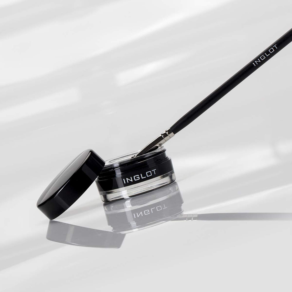 Inglot brush stroke of gel on white showing intense black pigment payoff