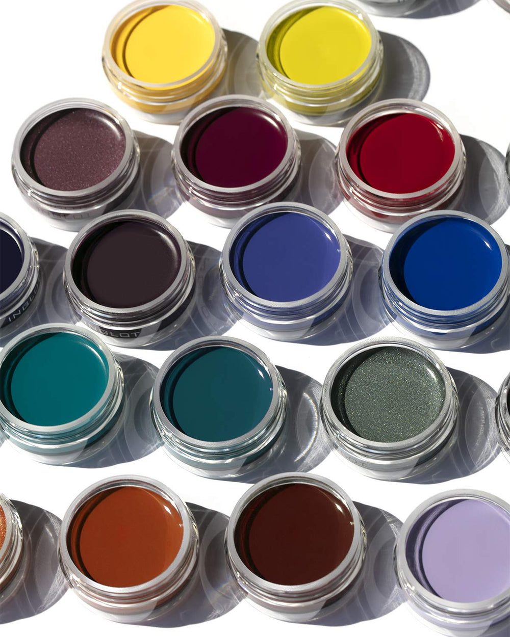Inglot product on vanity with tools showing professional-ready styling