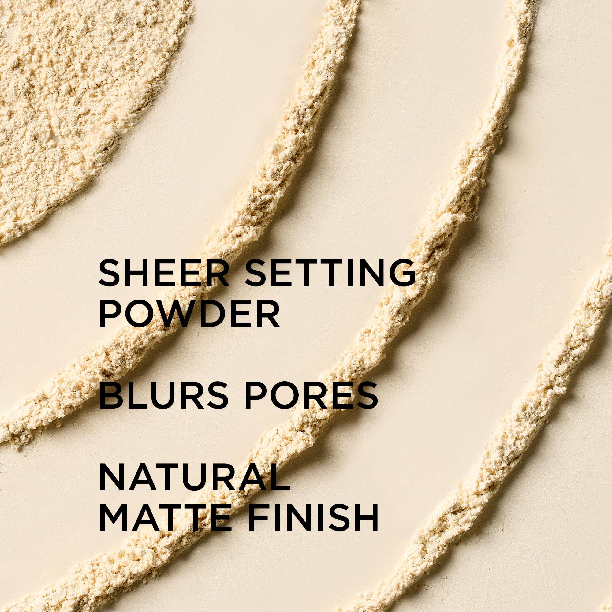 IT Cosmetics powder being swept with brush to set makeup and mattify shine