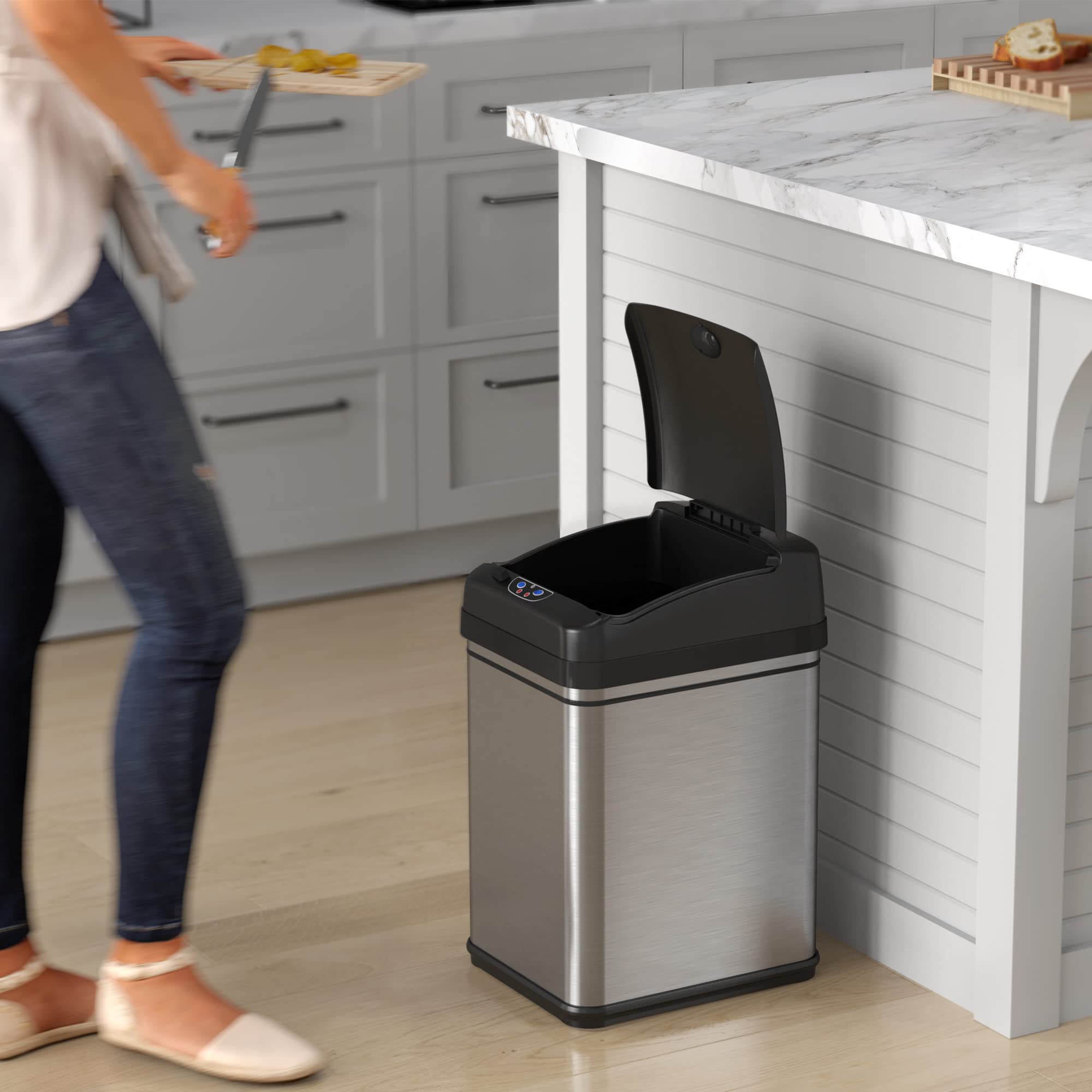 iTouchless trash can next to counter showing space-saving rectangular fit benefit