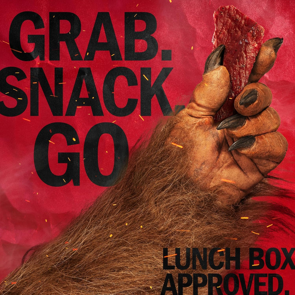 Jack Link's snack in hand on a trail demonstrating outdoor protein portability