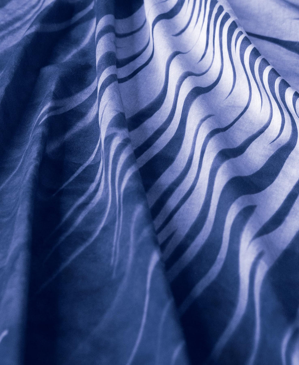 Jacquard rinse process in a tray revealing crisp Prussian blue contrast after washing