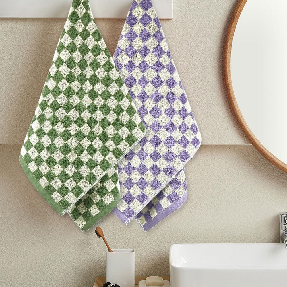 Four Jacquotha towels laid out in yellow green orange purple for easy ID