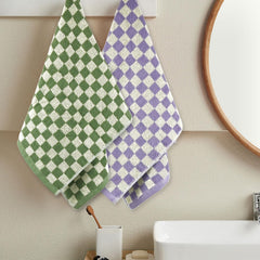 Four Jacquotha towels laid out in yellow green orange purple for easy ID