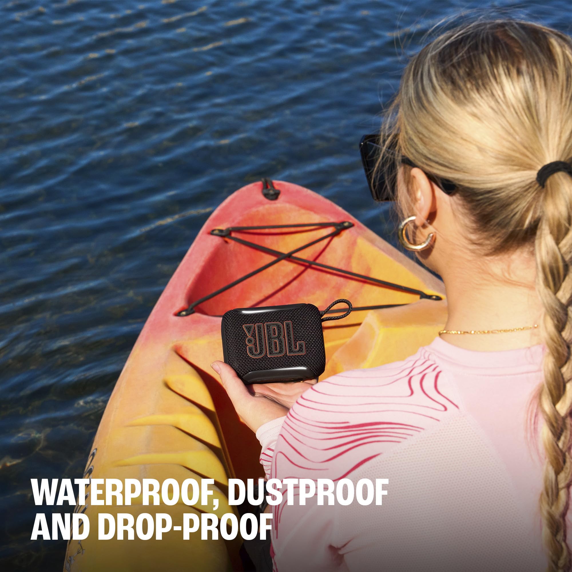 JBL Go 5 on a picnic blanket showing outdoor-friendly music benefit