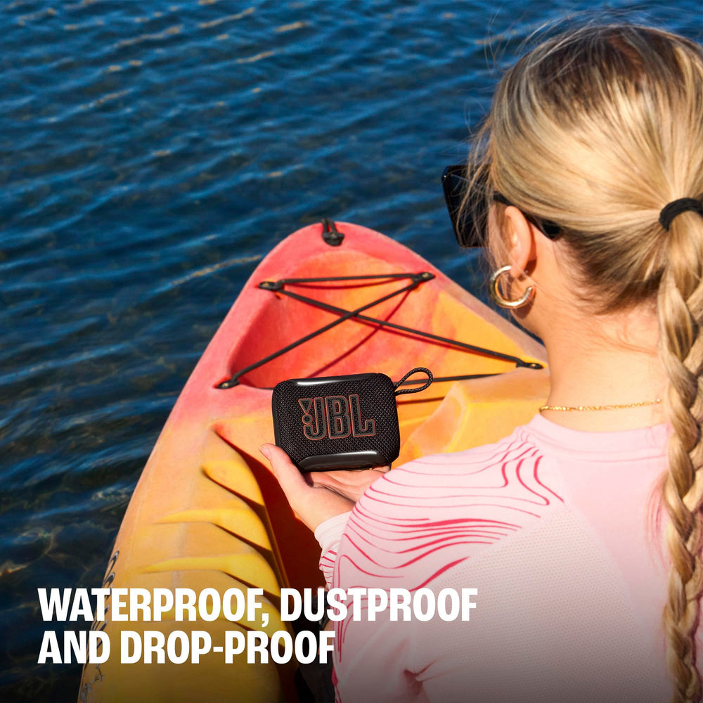 JBL Go 5 on a picnic blanket showing outdoor-friendly music benefit