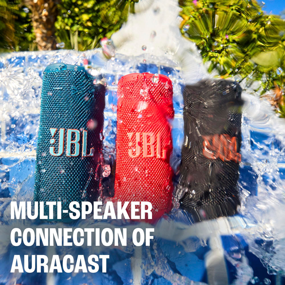 JBL Grip on rocky beach demonstrating IP68 waterproof protection