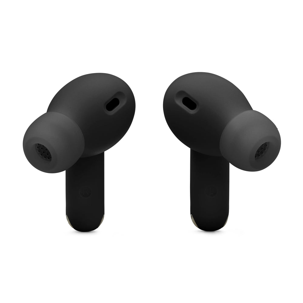 Lifestyle shot of JBL Vibe Beam 2 in use during commute showing long battery endurance