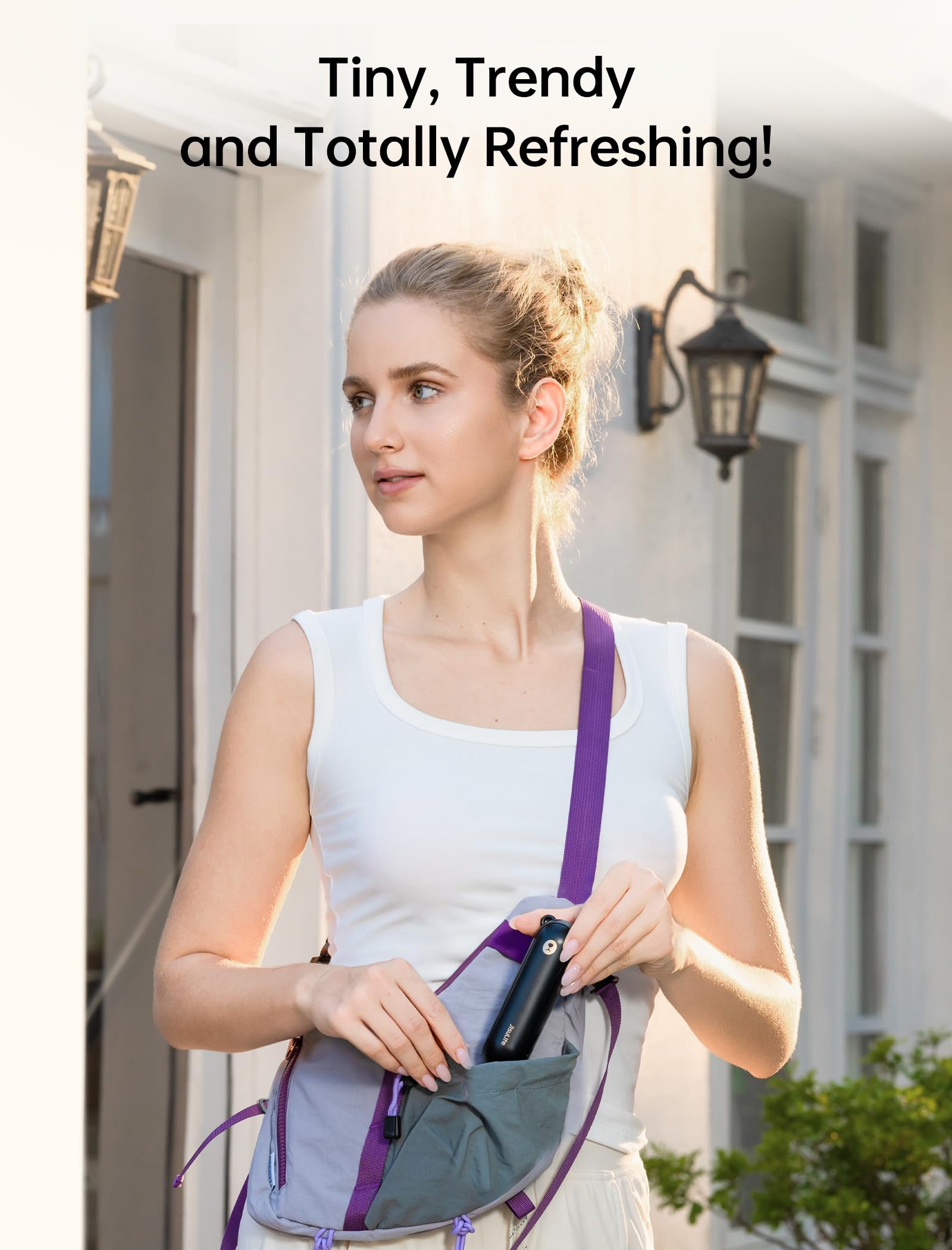 JISULIFE handheld fan in use outdoors demonstrating personal cooling benefit