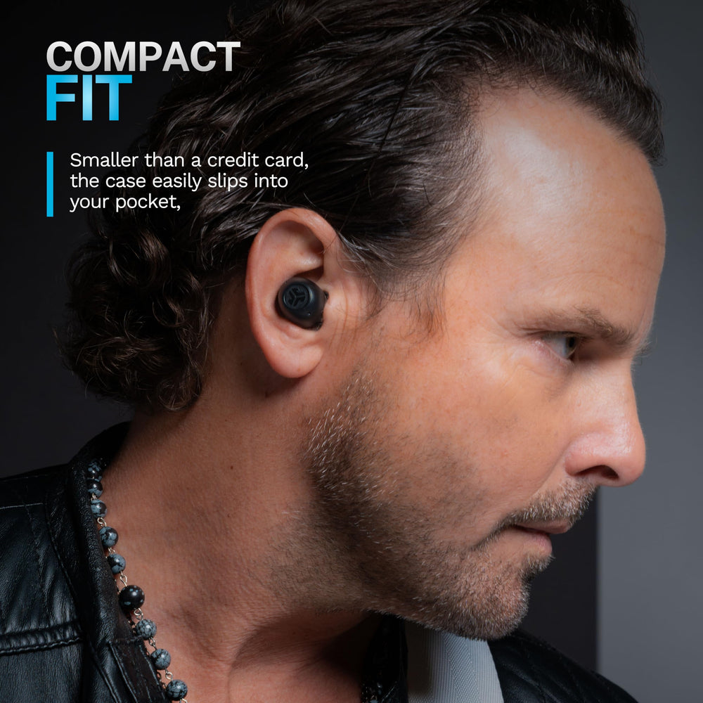 JLab earbuds worn by commuter showing ANC benefit for travel focus