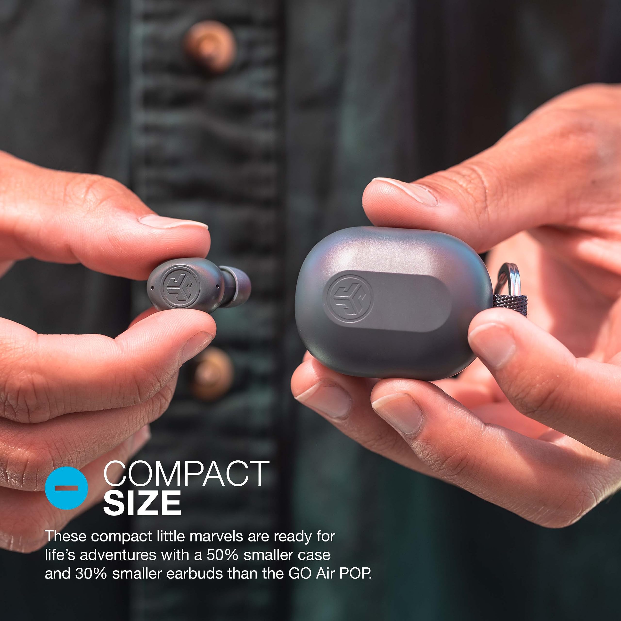 JLab JBuds Mini charging case open revealing earbuds and extra charges on the go