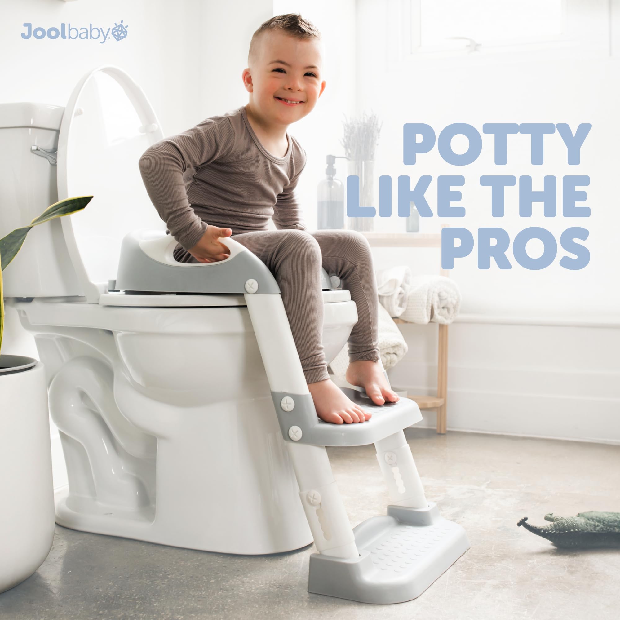 Jool Baby size comparison beside toilet showing scale and fit
