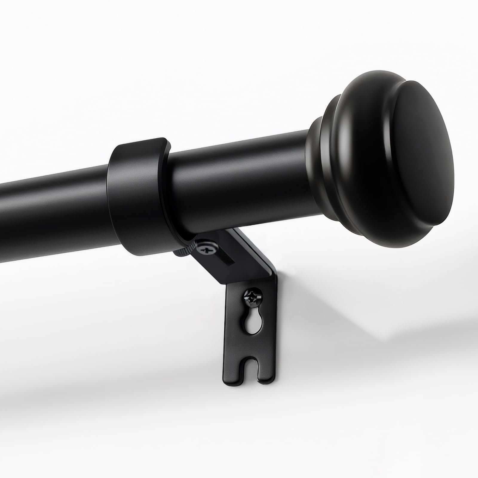 Joydeco front view of black adjustable curtain rod in packaging, shows complete kit and quick setup benefit