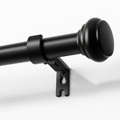 Joydeco front view of black adjustable curtain rod in packaging, shows complete kit and quick setup benefit