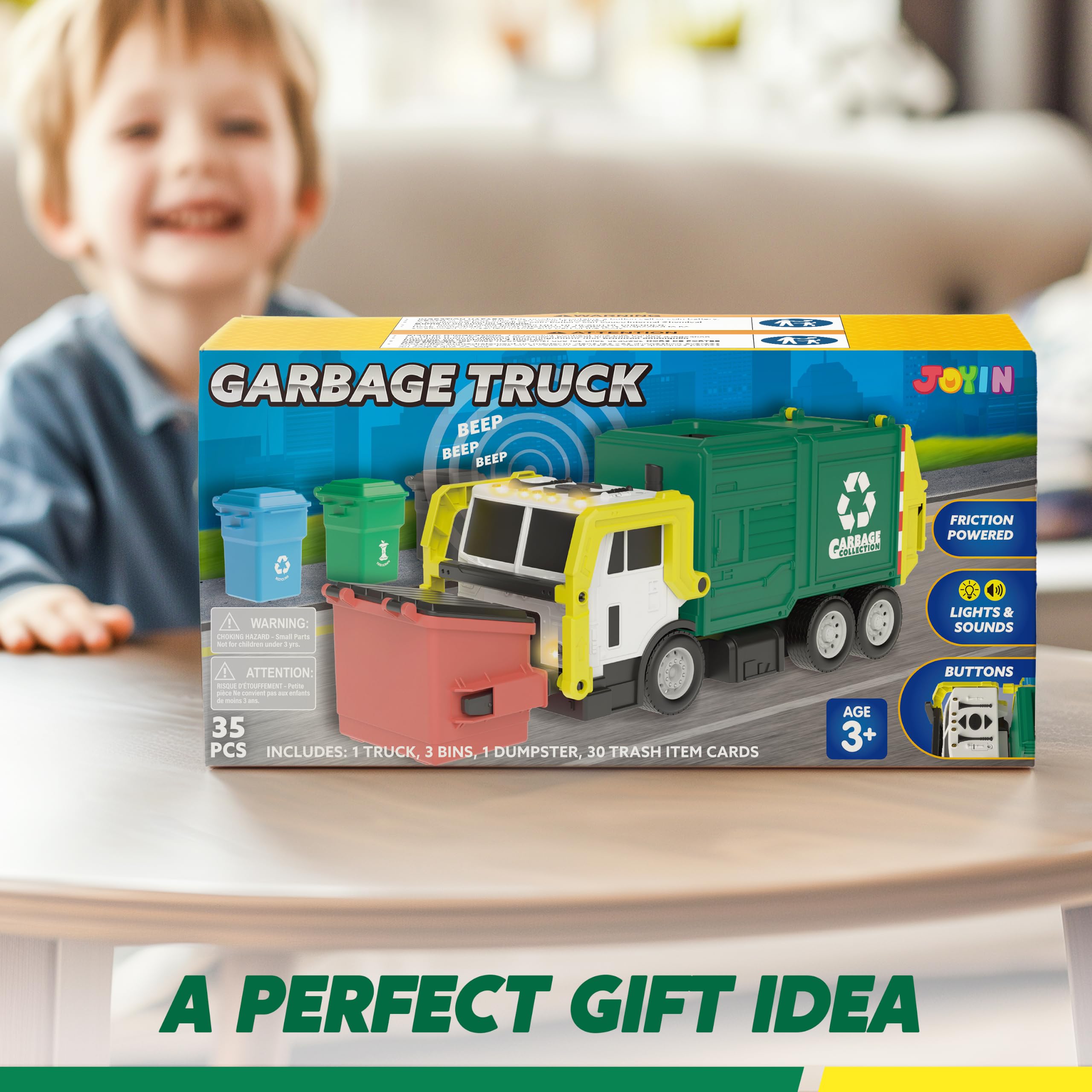 JOYIN truck beside a child’s hand showing size and easy handling