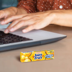 Juicy Fruit in hand size comparison illustrating compact convenience