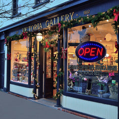 KEBE sign hung in a window providing instant storefront attraction