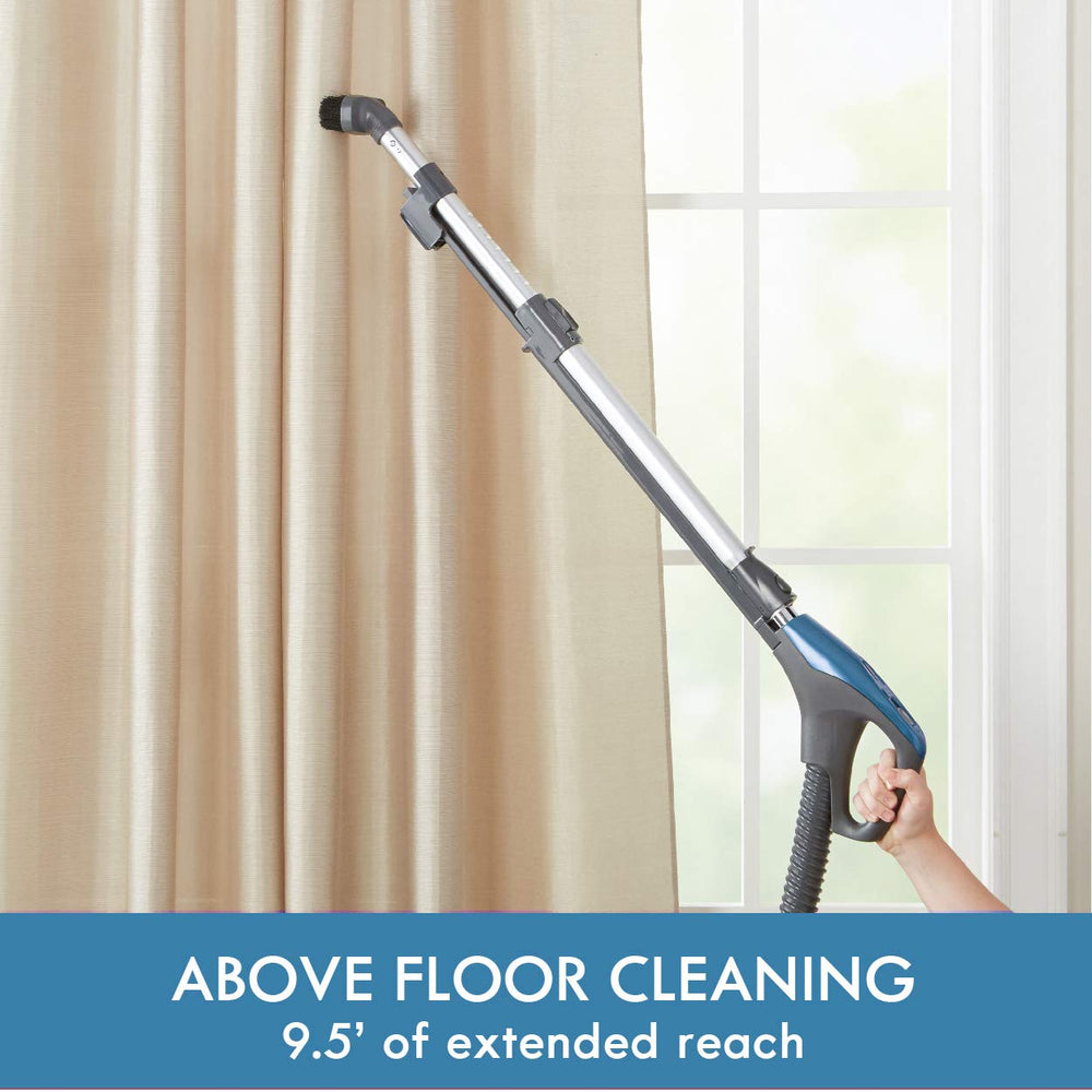 Kenmore vacuum with onboard storage displaying brush, crevice tool and bare floor tool for quick access