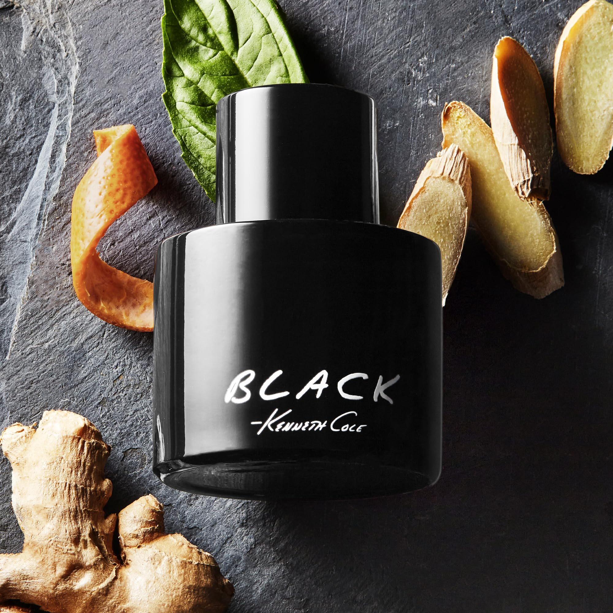 Kenneth Cole Black held in hand to show 0.5 oz travel size and convenient portability