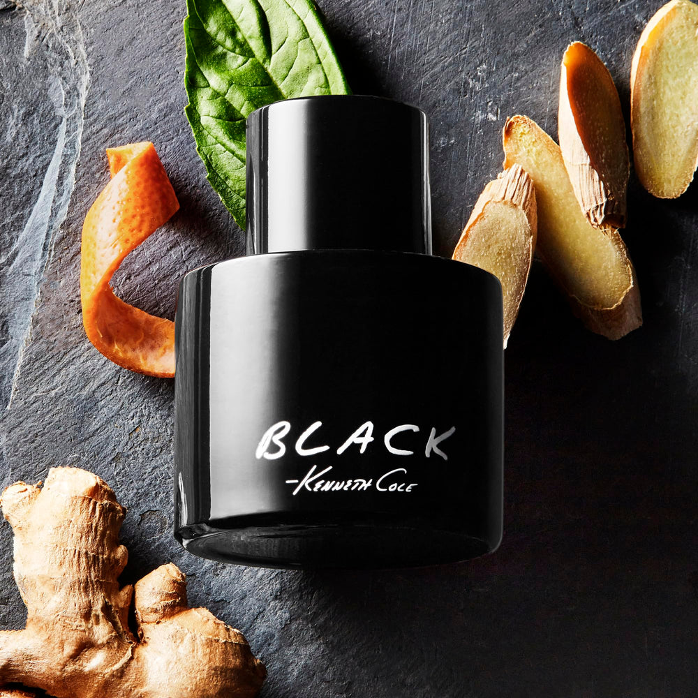 Kenneth Cole Black held in hand to show 0.5 oz travel size and convenient portability