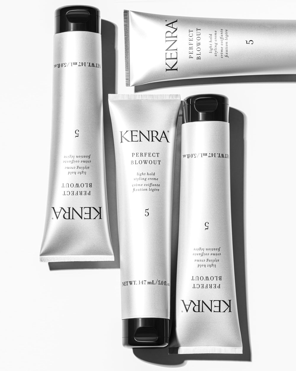 Kenra tube next to ruler showing 5 fl oz size for scale
