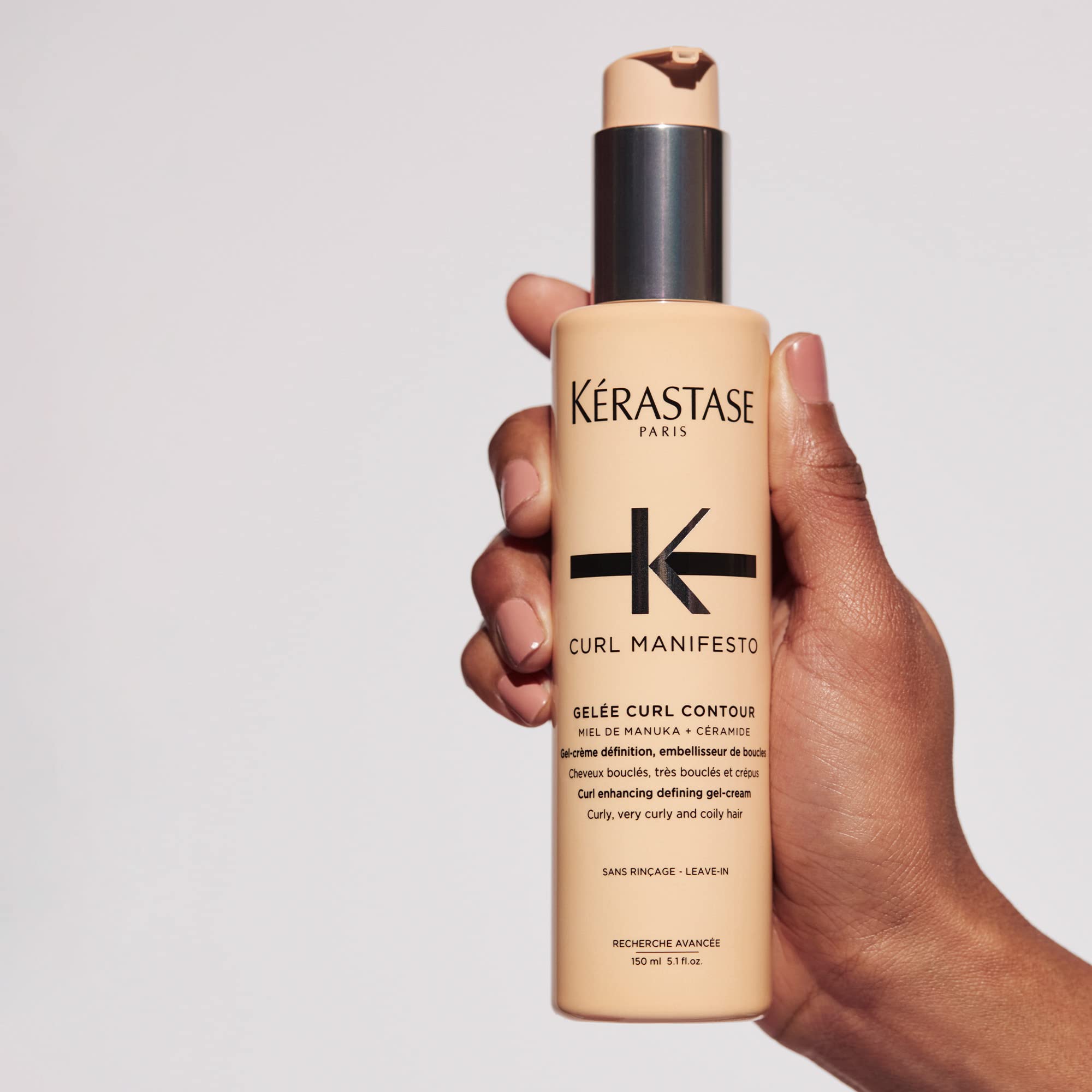 KÉRASTASE on a bathroom shelf styled lifestyle shot showing premium routine benefit