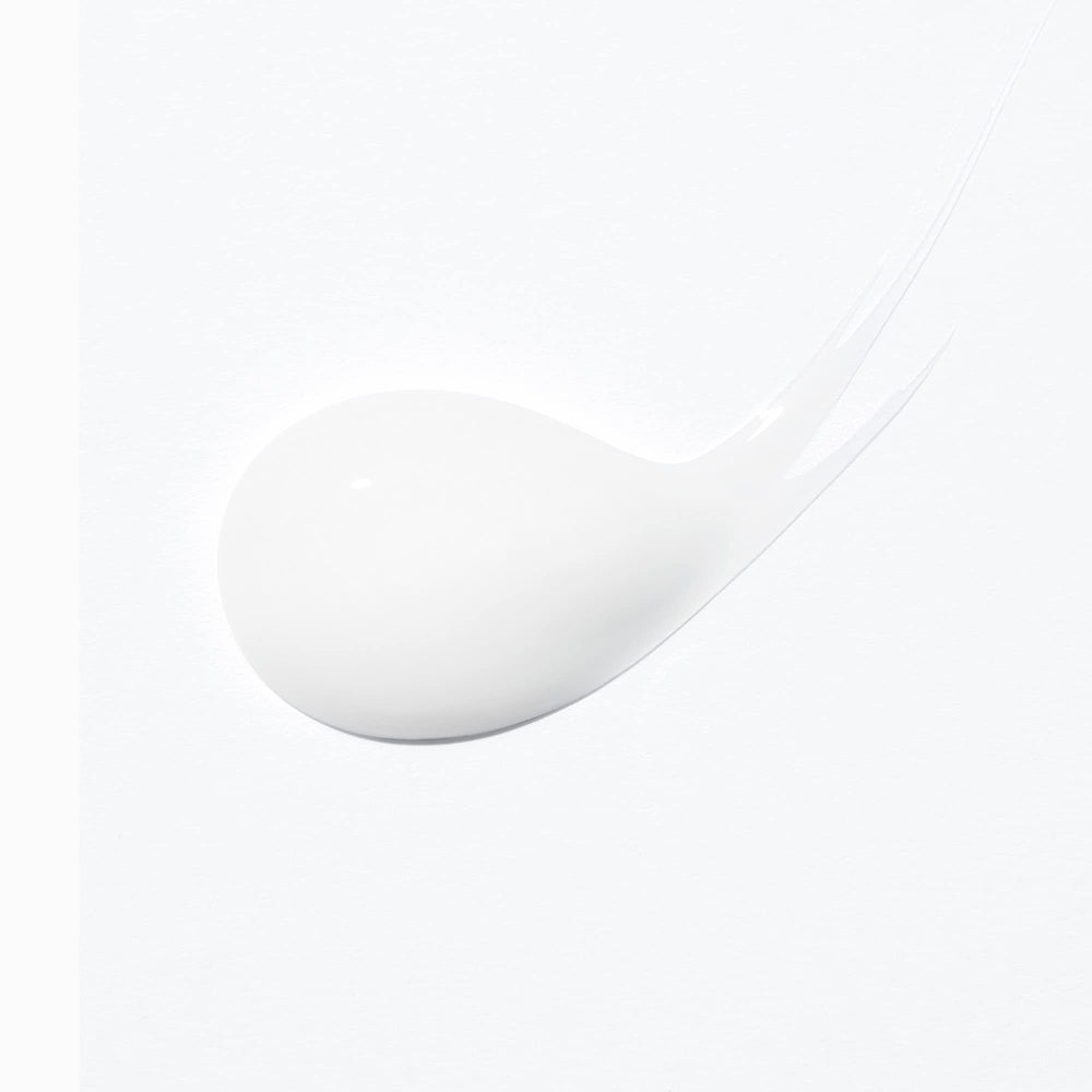 KÉRASTASE next to a ruler showing 5.07 fl oz scale and travel-ready benefit