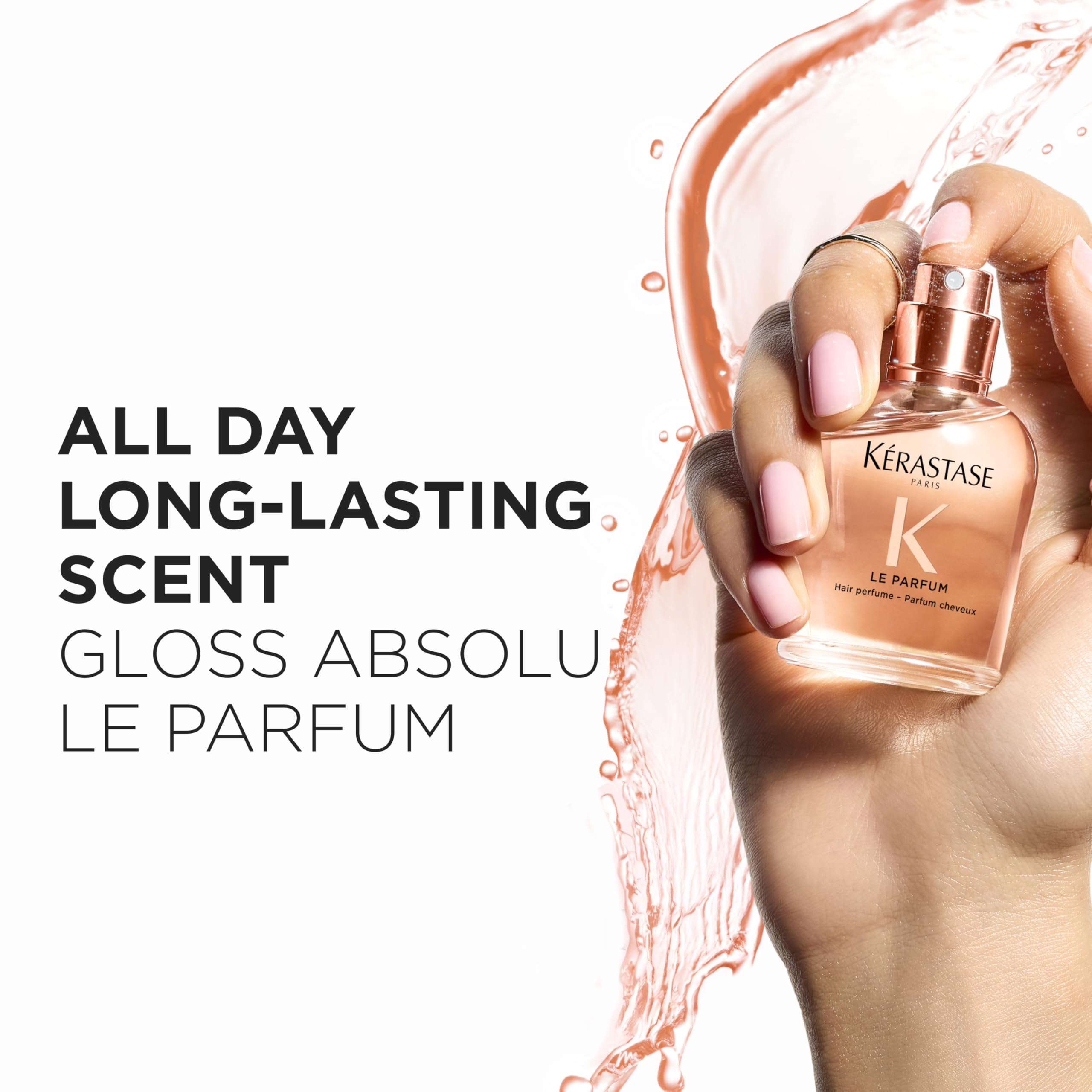 KÉRASTASE bottle held in hand to show 1.7 oz scale and portable convenience