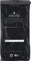 Kicking Horse Grizzly Claw brewed cup in kitchen lifestyle displaying deep color