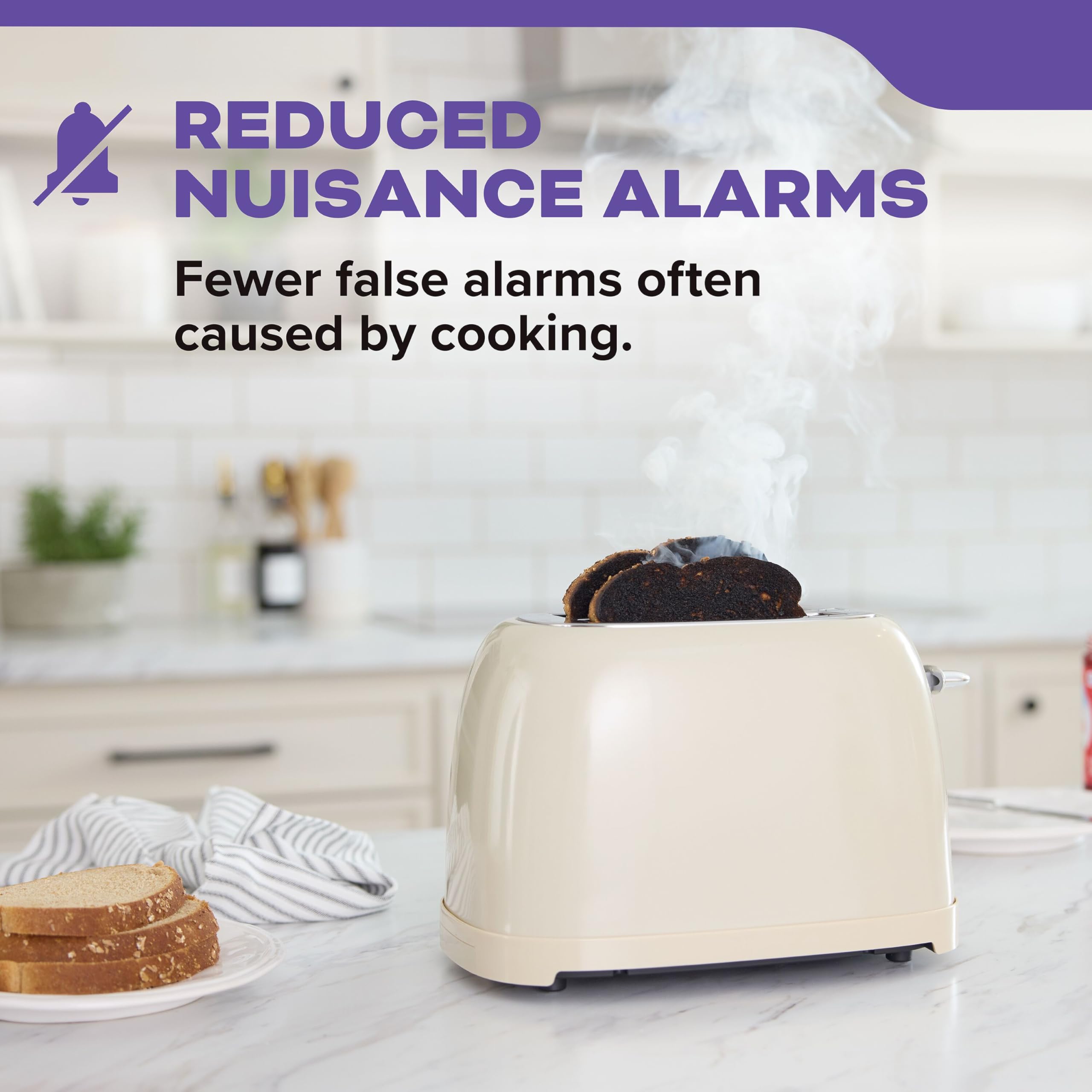 Kidde unit mounted near kitchen showing reduced false alarm design benefits