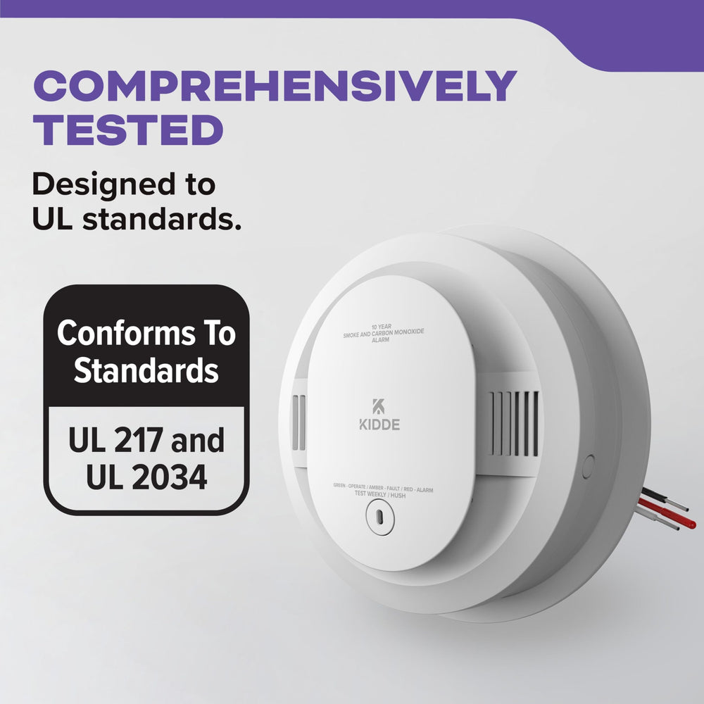 Kidde alarm next to a ruler showing compact size for easy placement