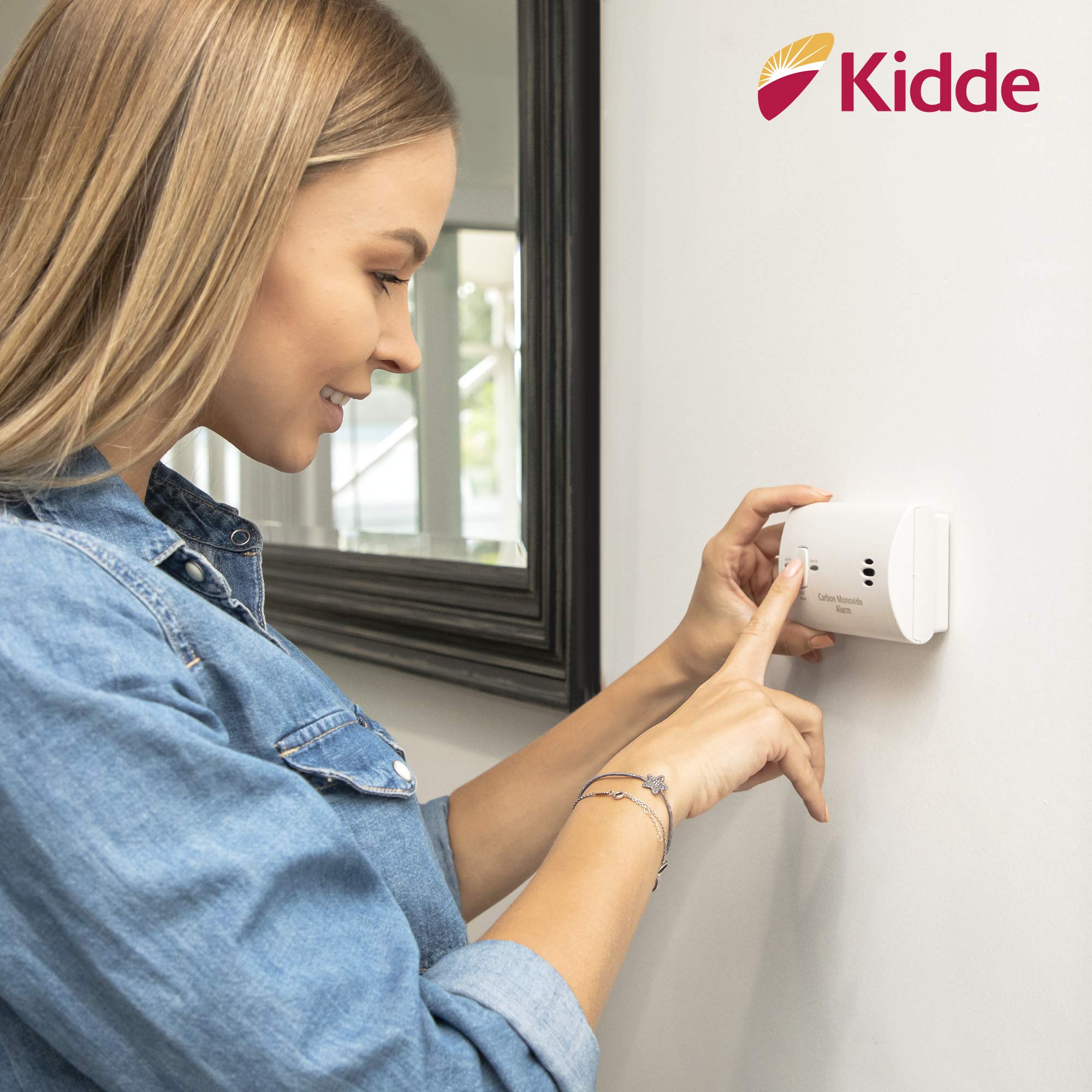 Kidde CO detector mounted in bedroom illustrating placement near sleeping areas for safety benefit