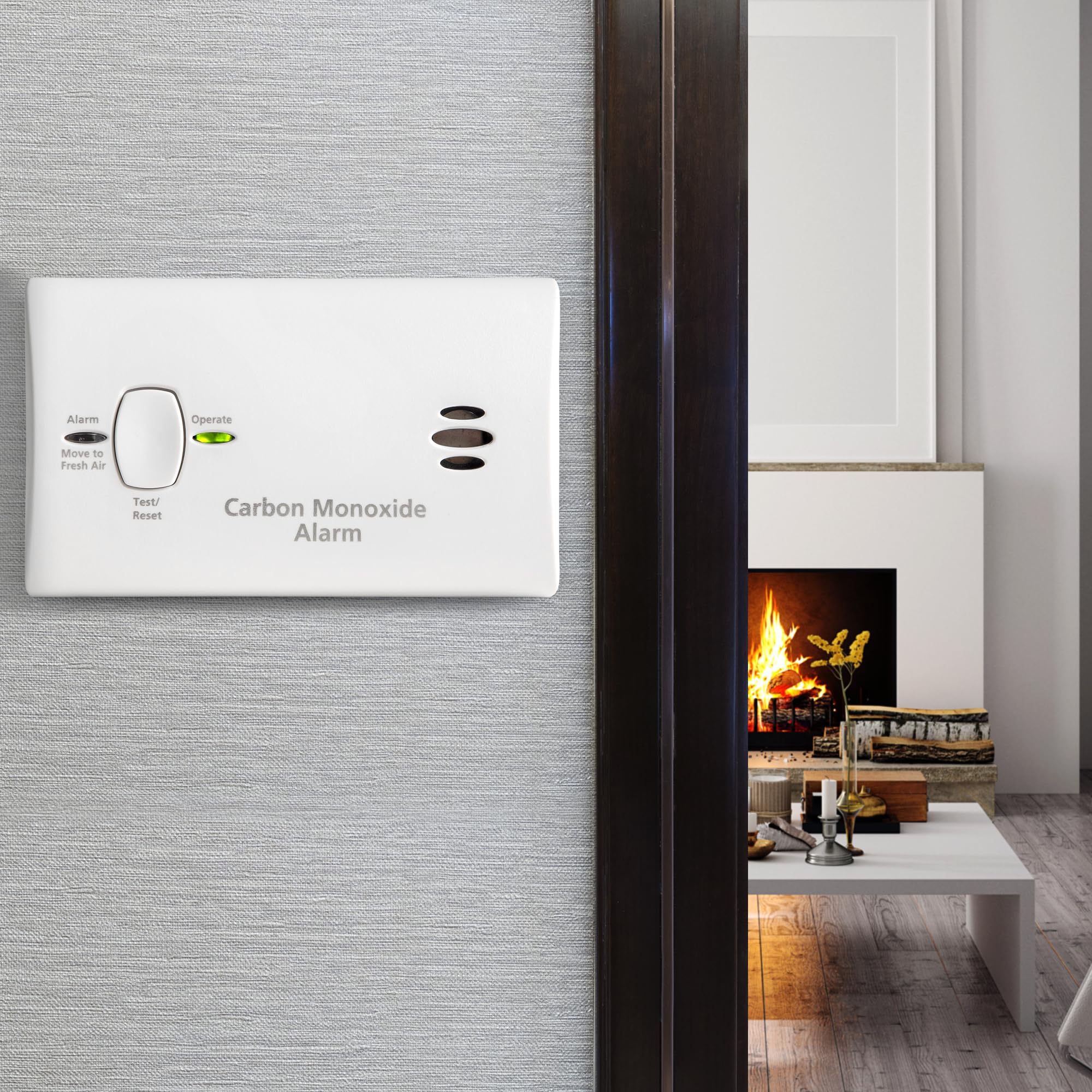 Kidde CO detector next to AA battery for scale showing compact size and portability benefit