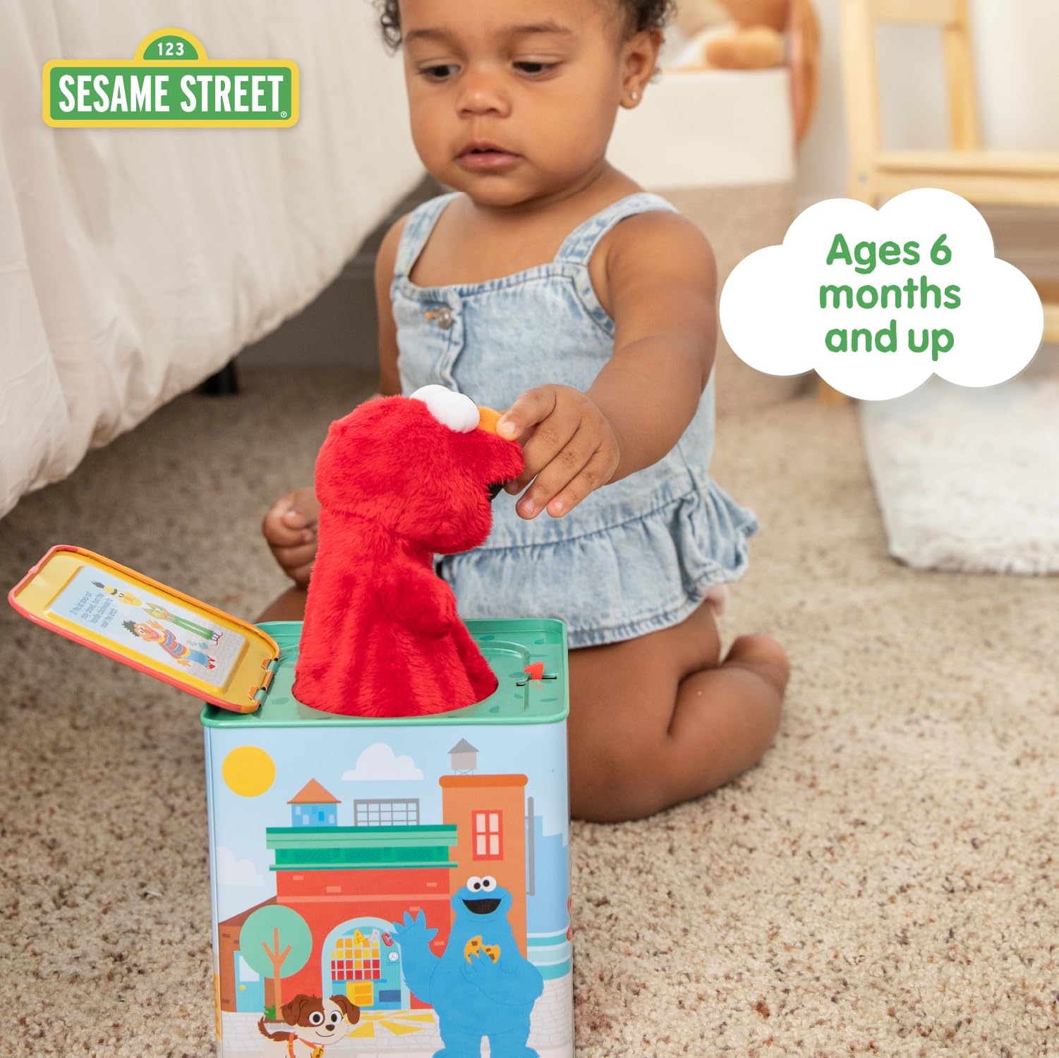 KIDS PREFERRED Elmo beside a toy to show compact, toddler-friendly size