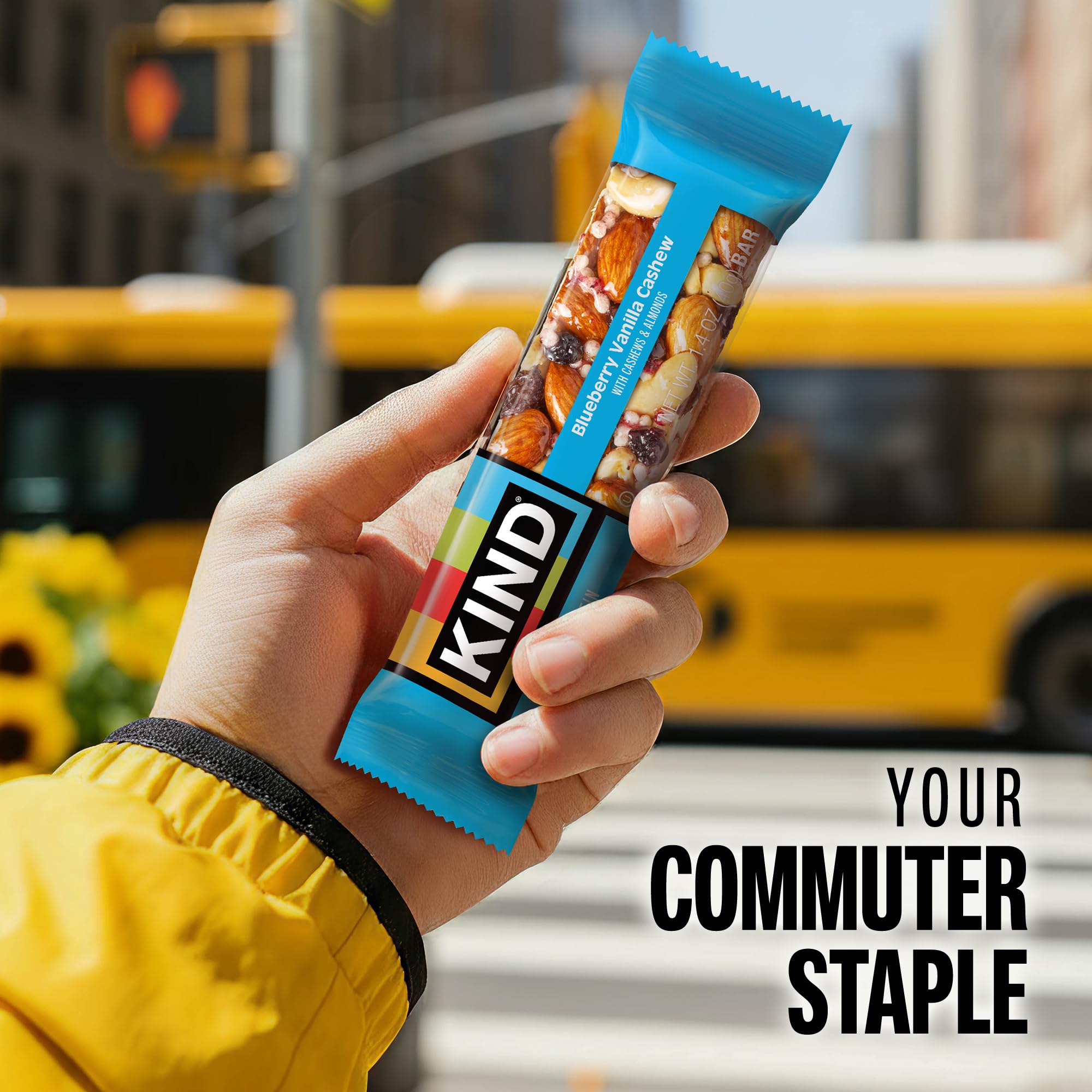 KIND bar in hand showing scale and portable, convenient serving