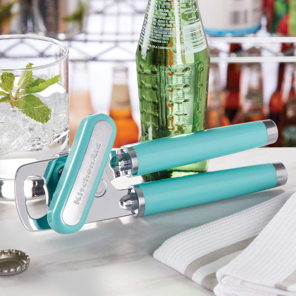 KitchenAid integrated bottle opener removing a cap for quick convenience