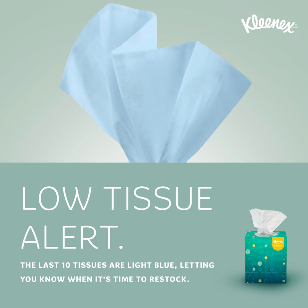 Kleenex box beside a dispenser illustrating compatibility and quick refill
