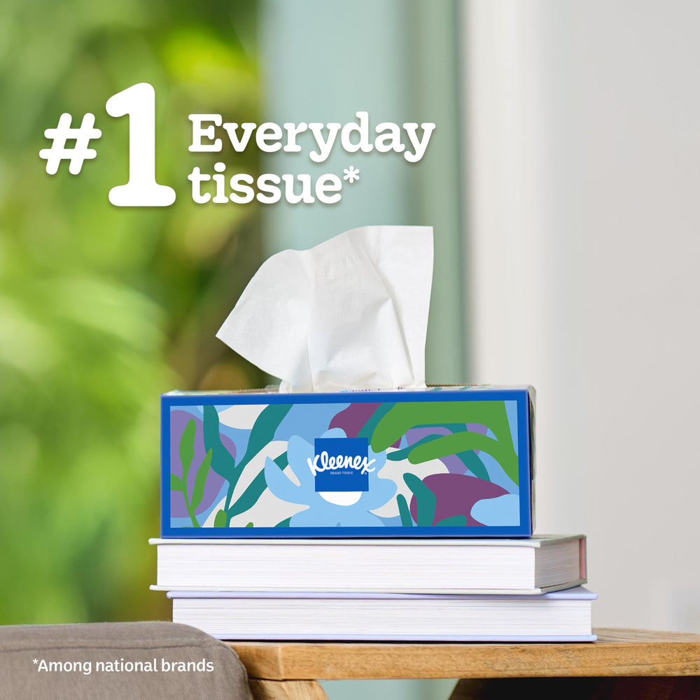Hand using Kleenex tissue to blot nose, gentle and strong