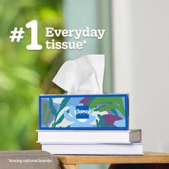 Hand using Kleenex tissue to blot nose, gentle and strong