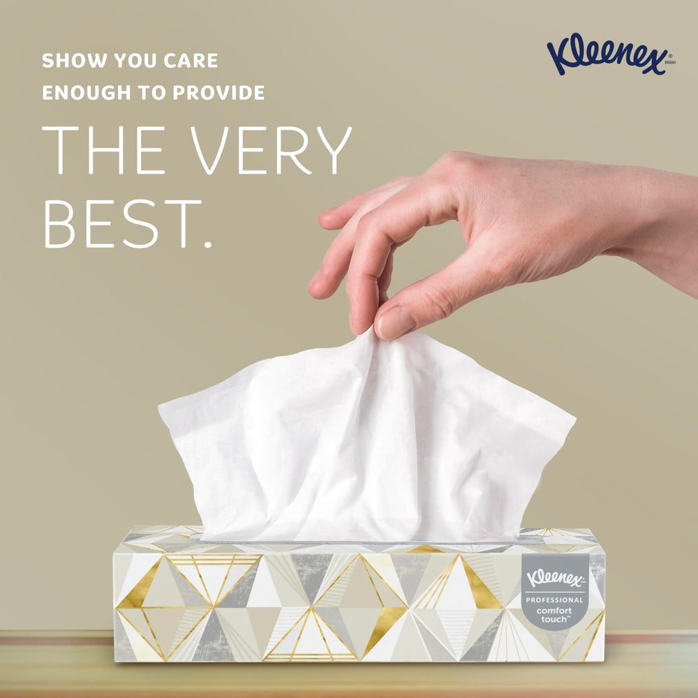 Hand pulling Kleenex tissue demonstrating easy dispensing and comfortable feel