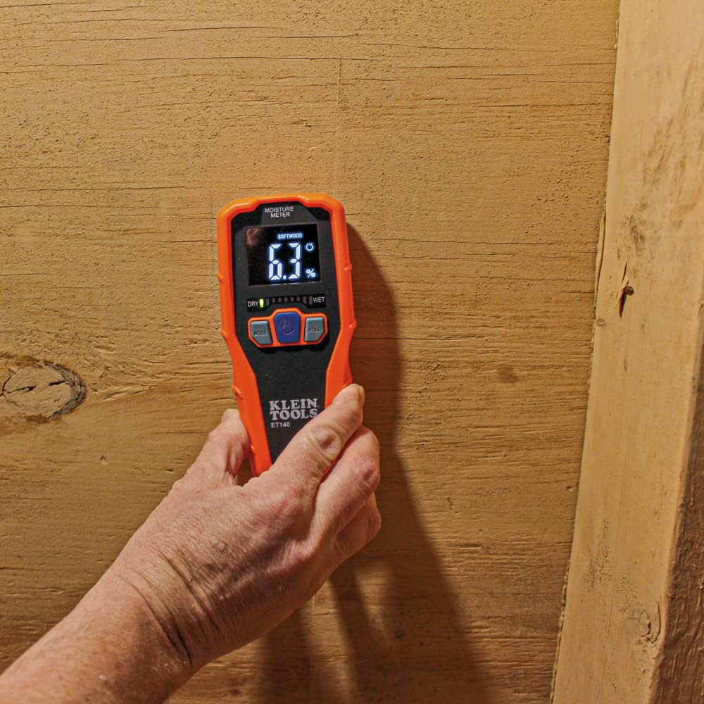 KLEIN TOOLS ET140 placed on hardwood floor showing non-destructive moisture testing