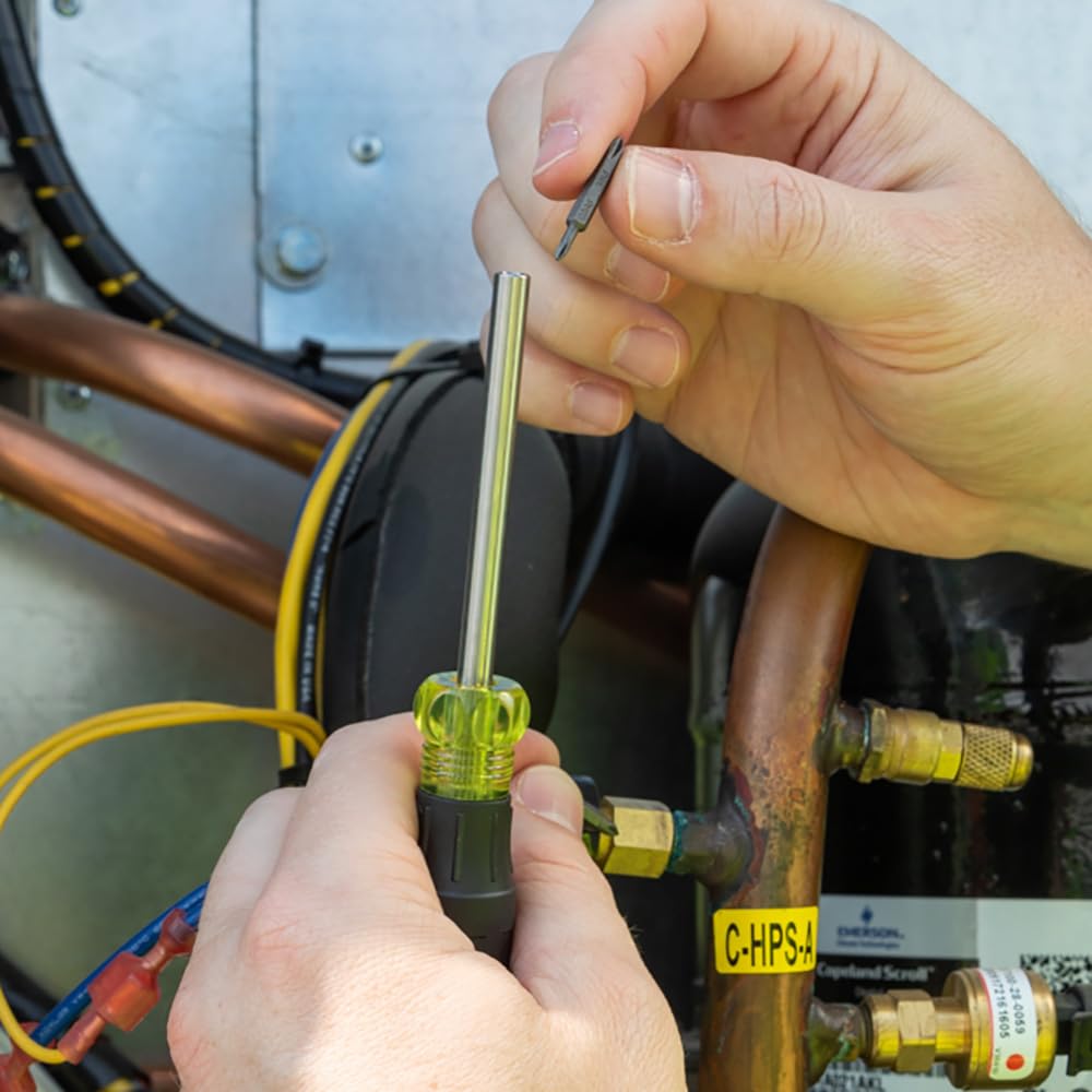 Klein Tools screwdriver in use at a terminal block demonstrating precise reach