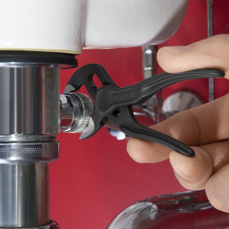 KNIPEX Cobra XS on a workbench with tools implying professional use and reliability