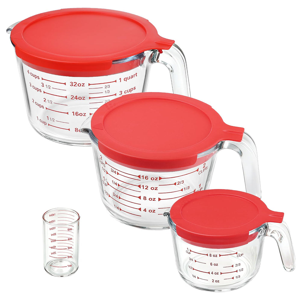 KOMUEE front view of four glass measuring cups showing sizes and lids for versatile use