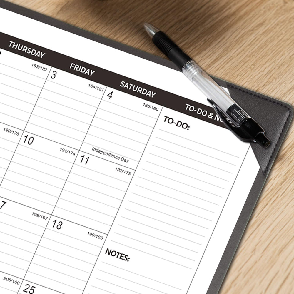 KOPEESY beside a notebook to show 22x17 scale for planning and workspace fit