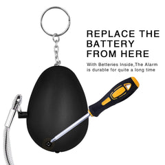 KOSIN alarm next to house key showing small, lightweight convenience