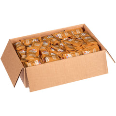 opened Kraft honey packet drizzling honey onto toast for easy serving benefit