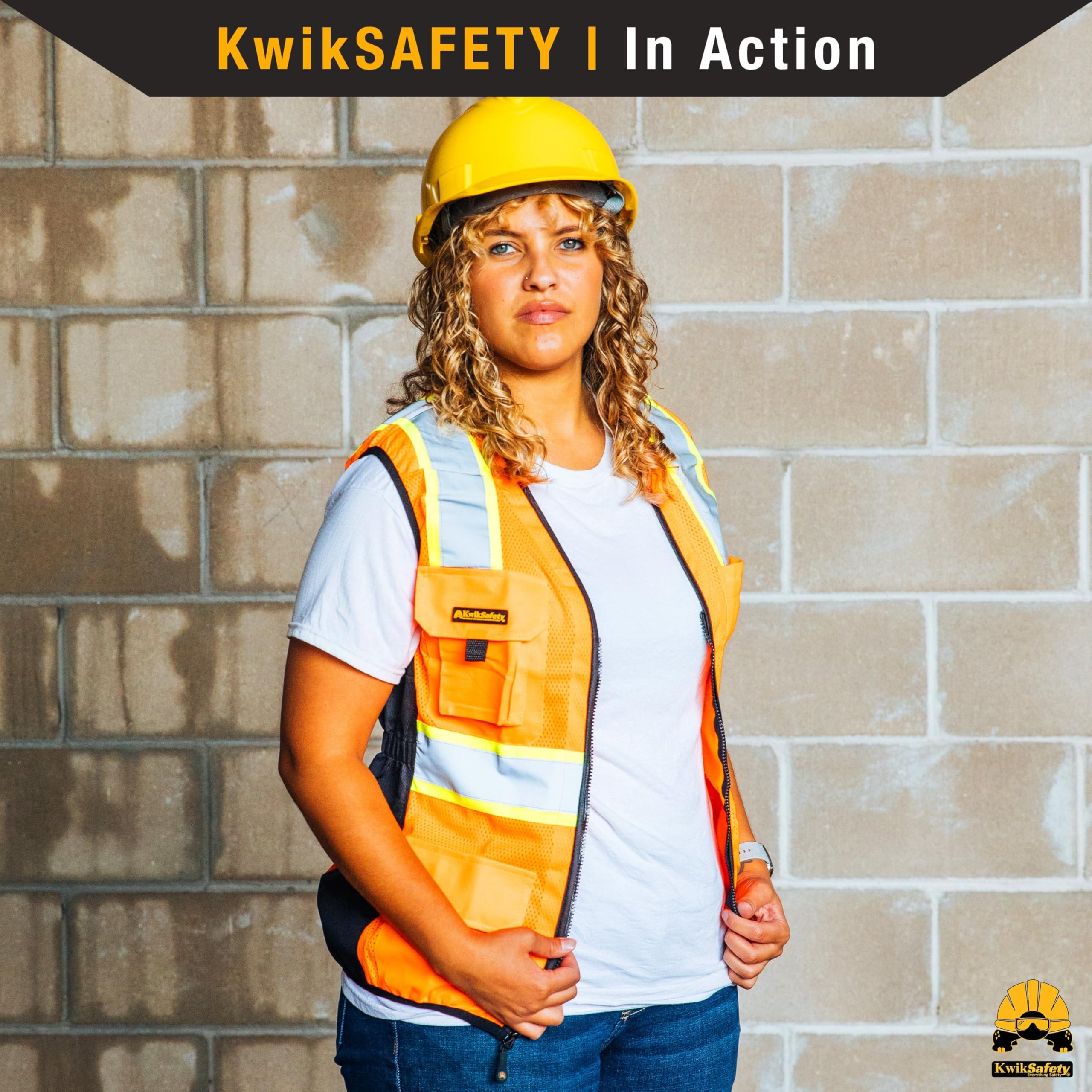 KwikSafety vest beside a hand for scale showing true-to-size fit and proportion